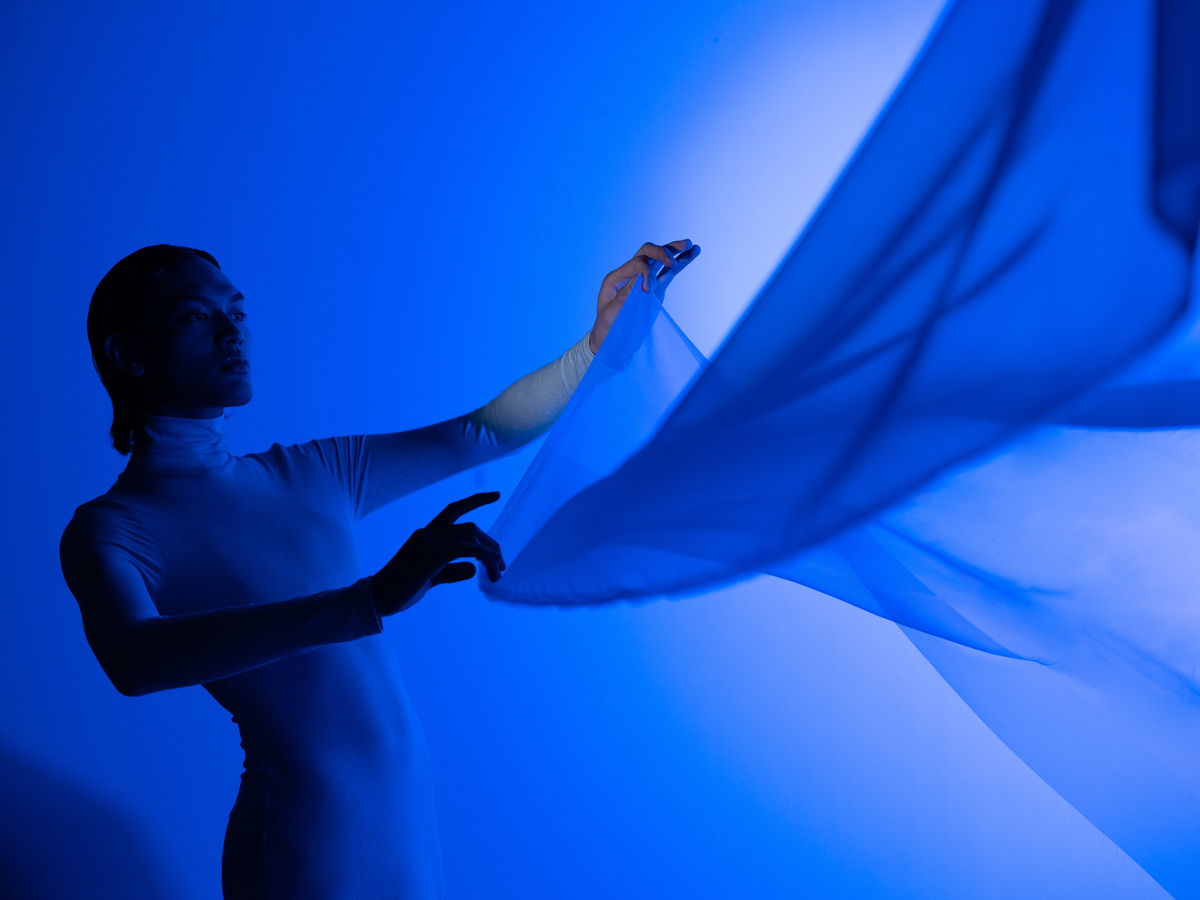 Holo AI Portrait of Person Holding Cloth with Blue Lighting